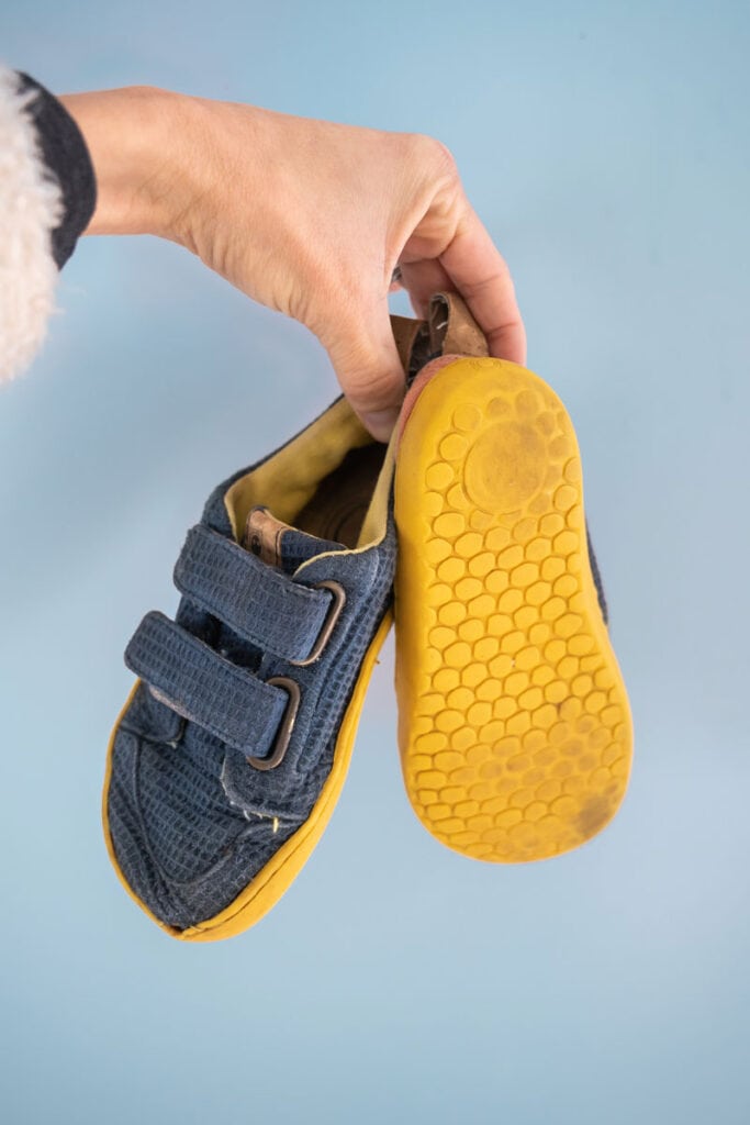 Well-worn kids barefoot shoes by Mukishoes